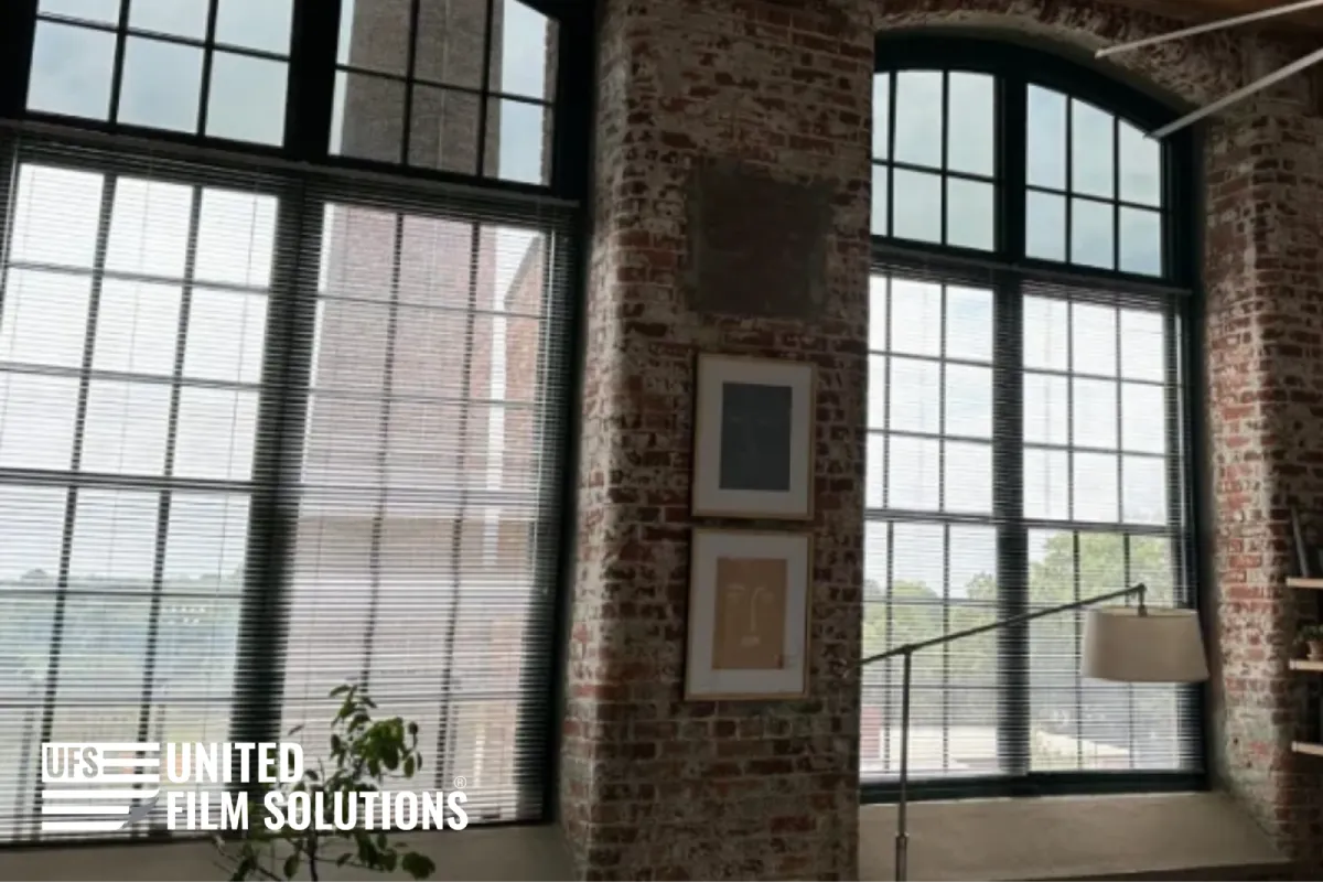 Decorative window film on large industrial-style windows.