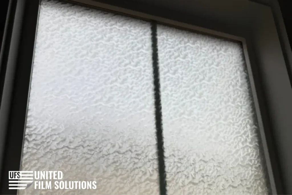 Textured decorative window film providing privacy.